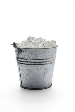 Ice bucket with ice isolated on a white background.