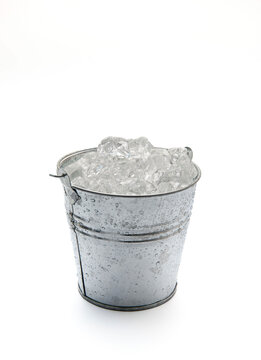 Ice bucket with ice isolated on a white background