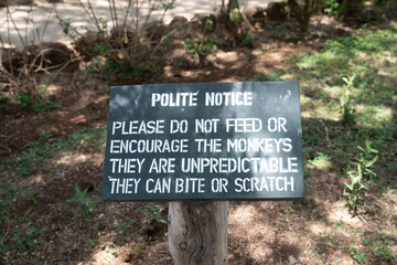 Sign for a polite notice - do not feed the monkeys, no feeding wildlife