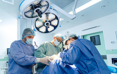 Operating doctor in hospital. Neurosurgery specilaists working in emergency room.