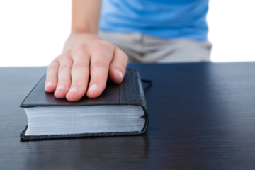 Woman praying with bible