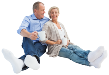 Happy mature couple having coffee