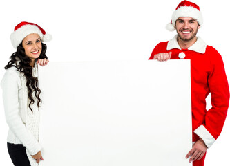 Festive couple showing placard