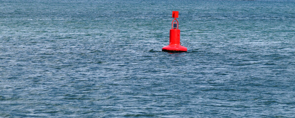 Close-up of a red buoy on the water for a horizontal background - Powered by Adobe