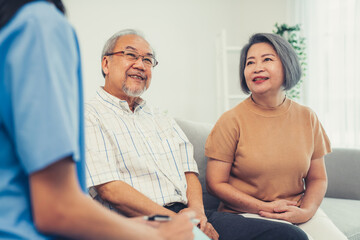 Female doctor visiting a contented elderly couple at their home. Health care, senior health support...
