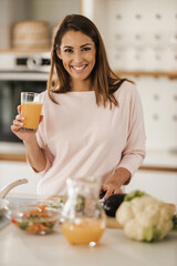 Woman Drinking Fresh Orange Juice