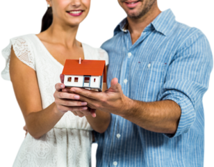 Couple holding house model
