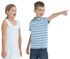 Young boy showing something to his sister