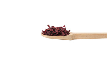 Dried beetroot slices on wooden spoon isolated on white background.