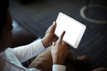 Cropped image of businessman using tablet
