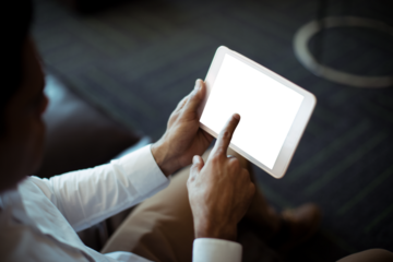 Cropped image of businessman using tablet