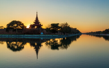 Extraordinary sunset at he Mandalay Moat in Myanmar