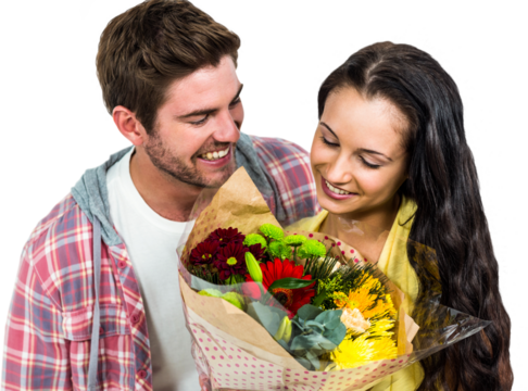 Happy couple looking at bouquet