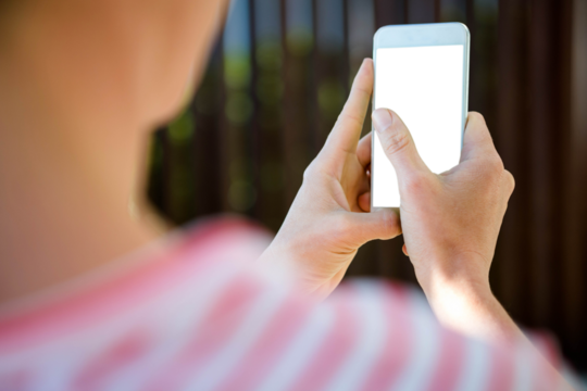 Female hands typing on smartphone