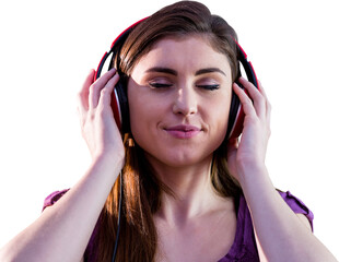 Close up woman listening music with headphones