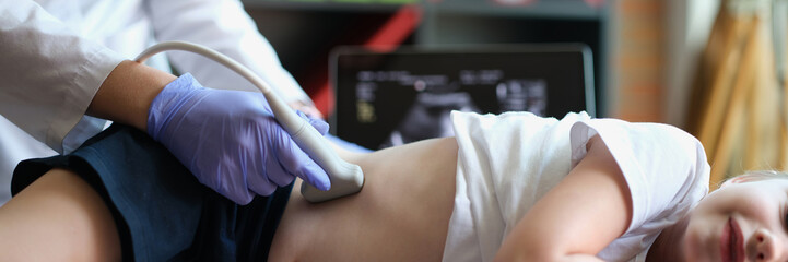 Diagnosis of lower back and kidneys in girl using ultrasound