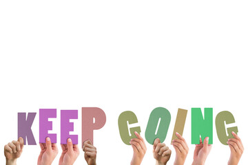 Cropped hands holding colorful words keep going 