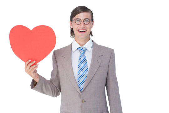 Geeky businessman smiling and holding heart card  - Powered by Adobe