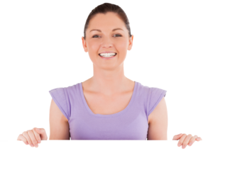 Portrait of a charming woman posing behind a billboard while standing