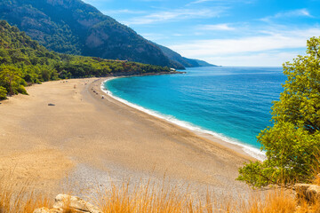 Beautiful Kidrak beach with sandy beach and blue water near Oludeniz town on the coast of Mugla region in Turkey © samael334