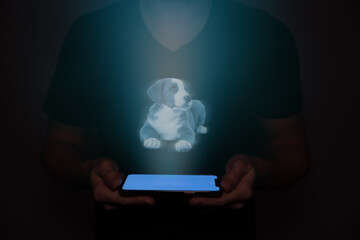 A hologram of a young puppy lying down projected from a mobile phone.