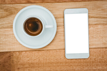 Fototapeta na wymiar Above view of a coffee and a smartphone