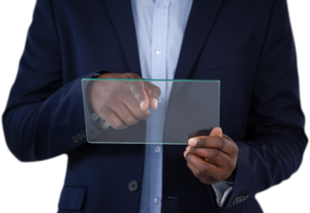 Mid section of businessman touching glass interface