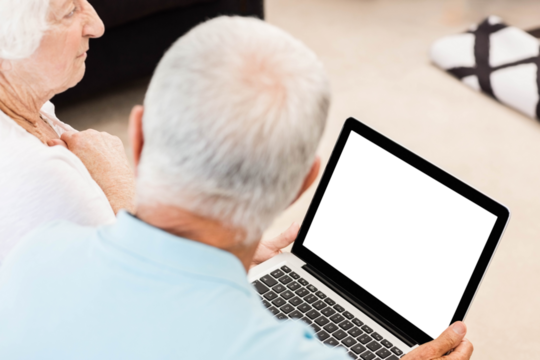 Focused senior couple using laptop - Powered by Adobe