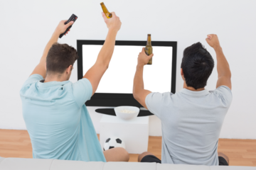 Excited soccer fans watching tv
