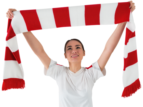Football fan waving red and white scarf