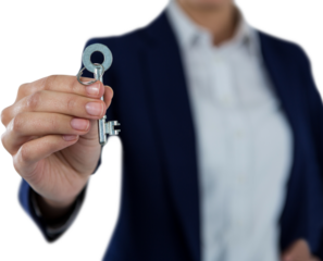 Mid section of businesswoman showing new house key