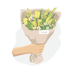 Hand holding a bouquet of flowers. Flower delivery mobile app.