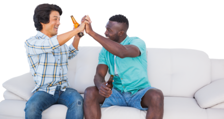 Football fans cheering while holding alcohol