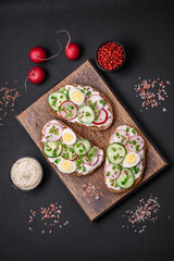 Delicious sandwich or bruschetta with cream cheese radish and green onions