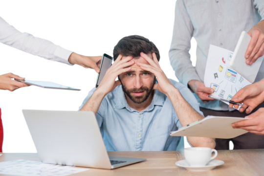 Portrait of frustrated businessman with colleagues at desk