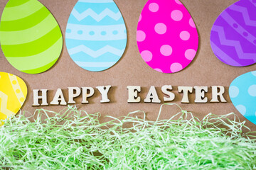 Happy Easter Text on a Brown Easter Background with colorful paper eggs