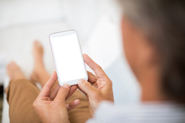 Man using mobile phone in living room