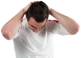 Disappointed football fan looking down