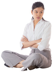 Annoyed businesswoman sitting with arms crossed