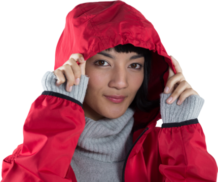 Smiling woman in hooded jacket standing against white background - Powered by Adobe
