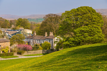 View of the buildings and gardens of the Sedbergh village. Yorkshire Dales, England, UK.