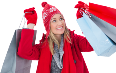 Blonde in winter clothes holding shopping bags
