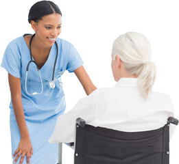 Smiling nurse assisting female patient in wheelchair