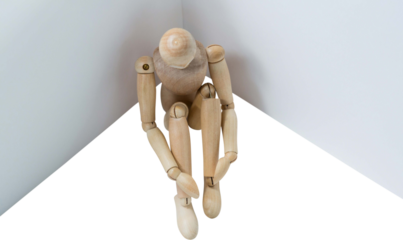 3d image of wooden figurine sitting by board 