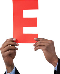 Cropped hand of businessman holding alphabet E