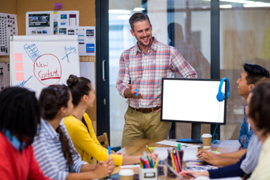 Businessman discussing with coworkers