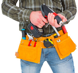 Fototapeta na wymiar Manual worker holding gloves and hammer power drill 