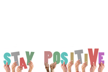 Colorful alphabet spelling stay positive held up by people 