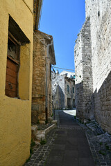 A narrow street among the old houses of Torre Cajetani, a medieval town in the province of Frosinone in Italy.