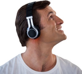 Close-up of mature man wearing headphones looking up